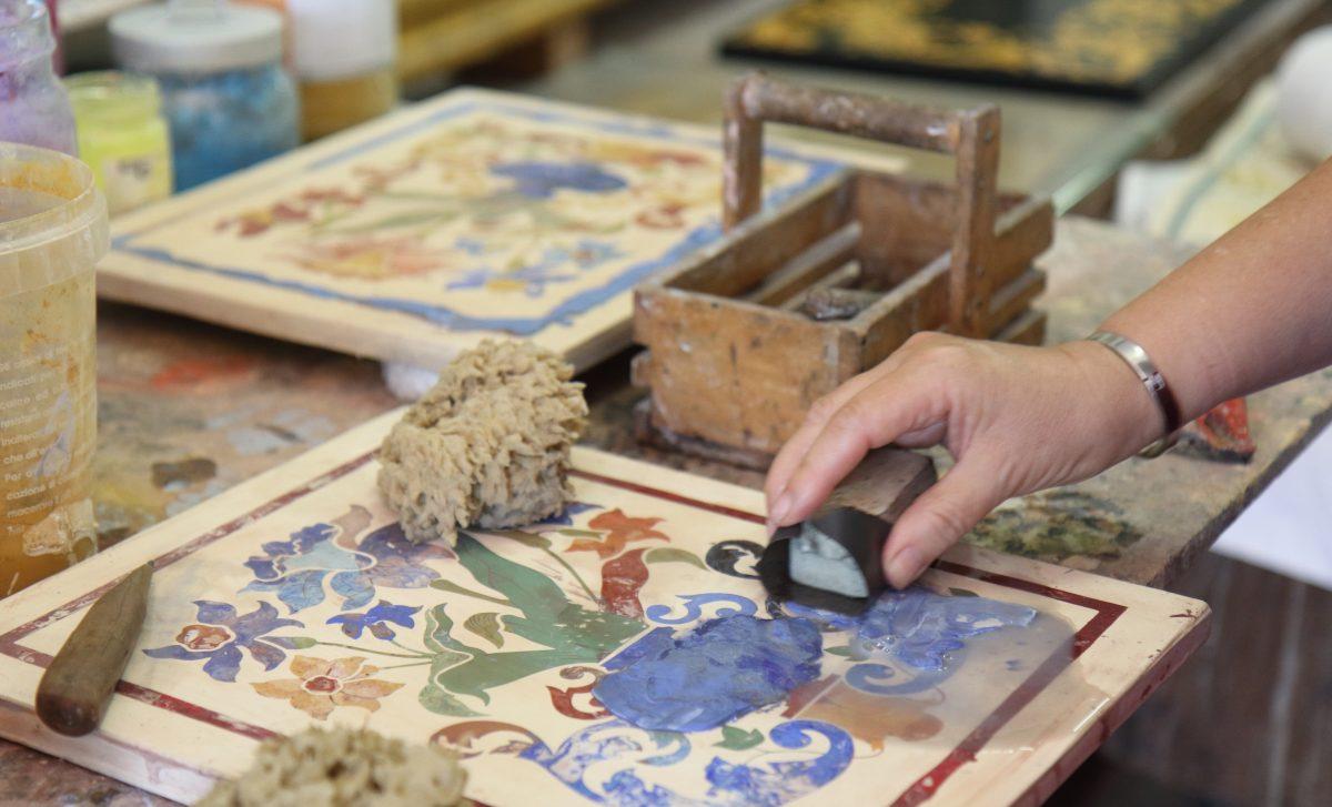 Sanding down the scagliola after each inlay is a particularly arduous process. (Lorraine Ferrier/The Epoch Times)