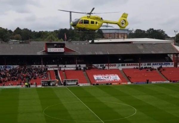An air ambulance descends onto Oakwell stadium in Barnsley, South Yorkshire, England on Sept. 22, 2018. (Danny Stewart via Storyful)
