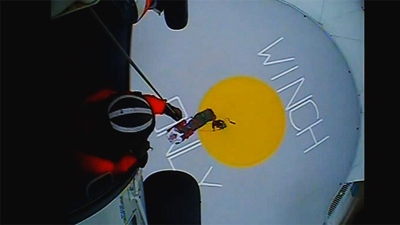 A Coast Guard helicopter crew hoists a sick passenger off the Norwegian Escape cruise ship 46 miles off the Nantucket coast. (Fox screenshot)