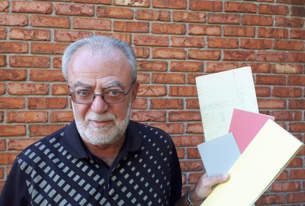 Josef Jurkovic holds faded copies of the student newspaper he edited in communist Czechoslovakia—an activity that got him arrested. (Courtesy of Josef Jurkovic)