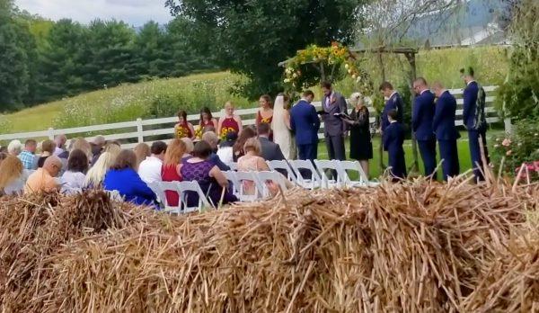 A wedding ceremony at Tripe J Farms, Catawba, Va., during which a motorized trimmer can seen be heard nearby in a video posted to Facebook on Sept. 17, 2018. (Kidd Carter via Storyful)