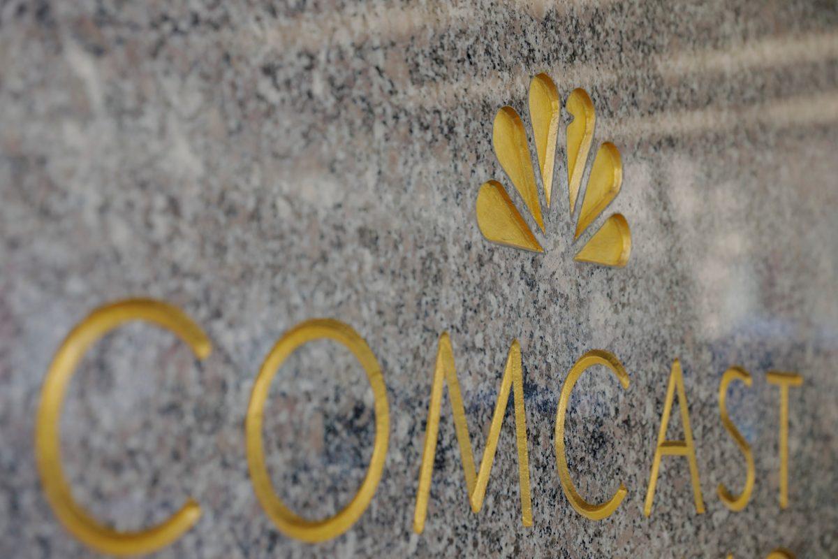 The NBC and Comcast logos are displayed on 30 Rockefeller Plaza in Midtown Manhattan in N.Y., Feb. 27, 2018. (Lucas Jackson/Reuters)