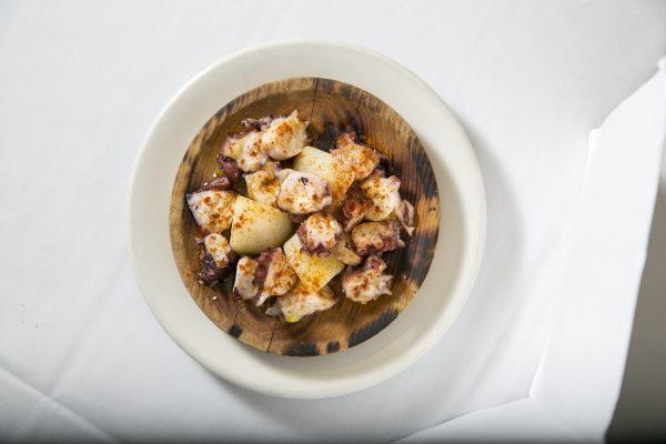 The Pulpo a la Gallega, a typical Galician dish, uses only octopus, olive oil, Spanish pimentón, and sea salt. (Samira Bouaou/The Epoch Times)