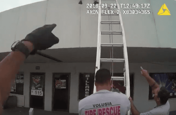 A shirtless alleged burglar was stuck on a roof in DeLand, Florida on Sept. 22, 2018. (Screenshot/Volusia County Sheriff)