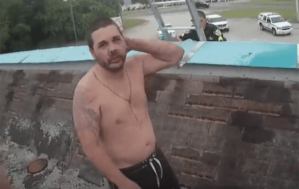 A shirtless alleged burglar was stuck on a roof in DeLand, Florida on Sept. 22, 2018. (Screenshot/Volusia County Sheriff)