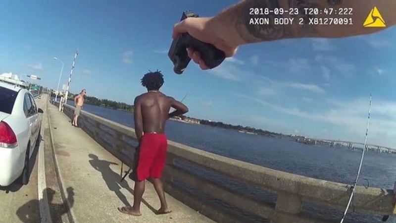 A Florida man was arrested after throwing another man from a bridge in Daytona Beach as an officer was driving by. (Daytona Police Department via Storyful)