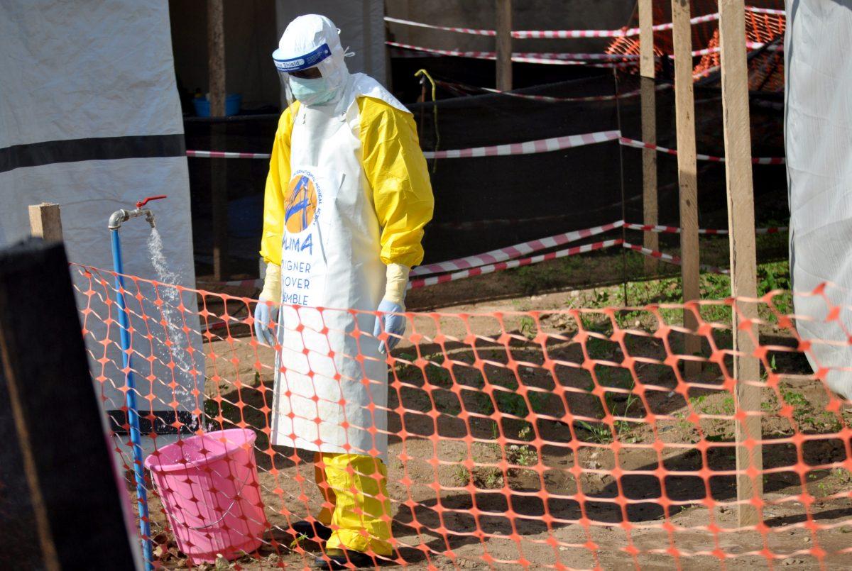 A medical worker wears a protective suit as he prepares to administer Ebola patient care at the Alliance for International Medical Action treatment center in Beni, Democratic Republic of Congo on Sept. 6, 2018. (Reuters/Fiston Mahamba)