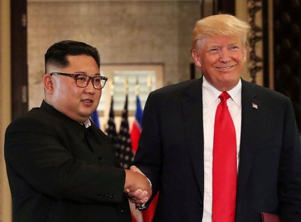 President Donald Trump and North Korea's leader Kim Jong Un during a summit at the Capella Hotel on the resort island of Sentosa, Singapore, June 12, 2018. (Reuters/Jonathan Ernst/File Photo)