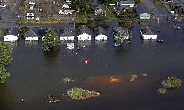 Floodwater from Hurricane Florence threatens homes in Dillon, S.C., Sept. 17, 2018. (AP Photo/Gerald Herbert)