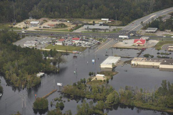 Flood waters from the Neuse River cover the area a week after Hurricane Florence in Kinston, N.C., Sept. 24, 2018. (Ken Blevins/The Star-News via AP)