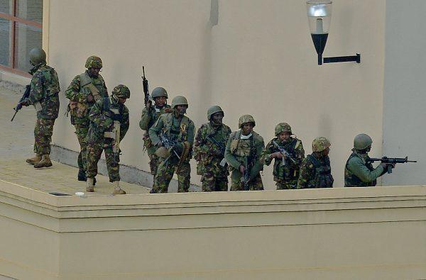Kenyan soldiers on top of the Westgate shopping mall in Nairobi, Kenya, on Sept. 24, 2013, after the al-Shabaab terrorist group attacked the mall, killing people inside the mall and holding many hostage. (Carl de Souza/AFP/Getty Images)