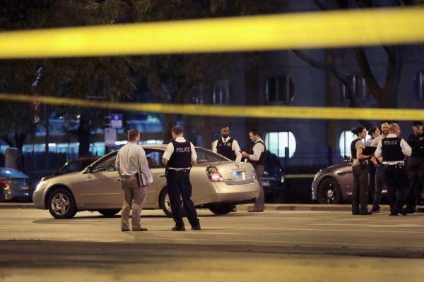 Police investigate the scene of a shooting near the Chinatown neighborhood where four people were shot in an apparent road rage incident in Chicago, Illinois on Sept. 19, 2018. (Scott Olson/Getty Images)