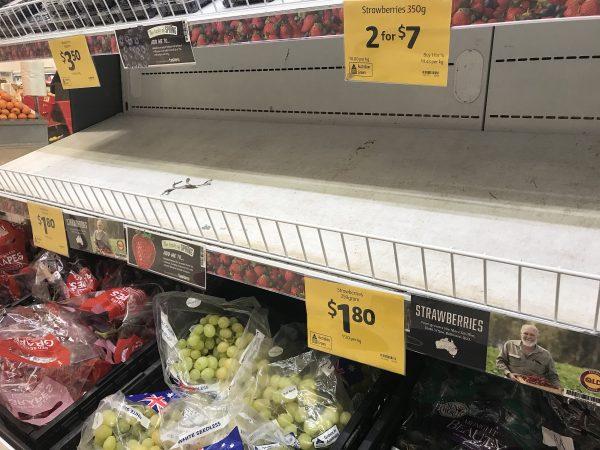 Empty shelves, normally stocked with strawberry punnets, are seen at a Coles Supermarket in Brisbane, Australia, on Sept. 14, 2018. (Dan Peled/AAP/Reuters)