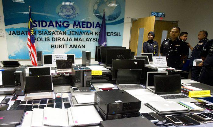 93 Chinese, 6 Malaysians Arrested for Alleged Phone Swindle
