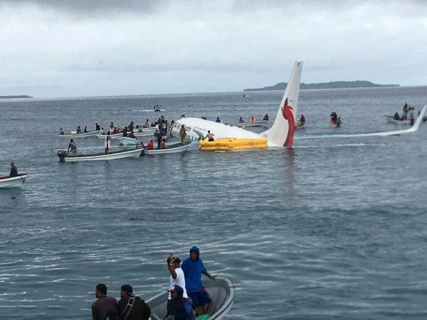 People are evacuated from an Air Niugini plane that crashed in the waters in Weno, Chuuk, Micronesia, Sept. 28, 2018, in this picture obtained from social media. (James Yaingeluo/via Reuters)