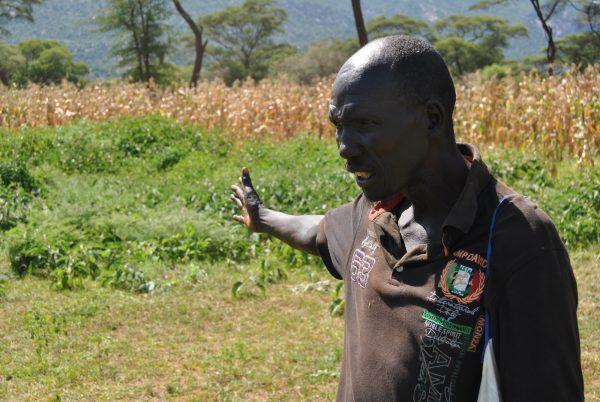 Bethuel Kibor, a member of the Marakwet tribe, points at the maize farm that sits on the border of the Elgeyo Marakwet and West Pokot counties in Kenya on Sept. 21, 2018. (Dominic Kirui/Special to The Epoch Times)