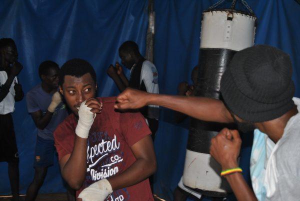Young men practice at a boxing club established by the Tegla Lorupe Foundation in the Kawangware slum in Nairobi, Kenya, on Sept. 27, 2018. (Dominic Kirui/Special to The Epoch Times)