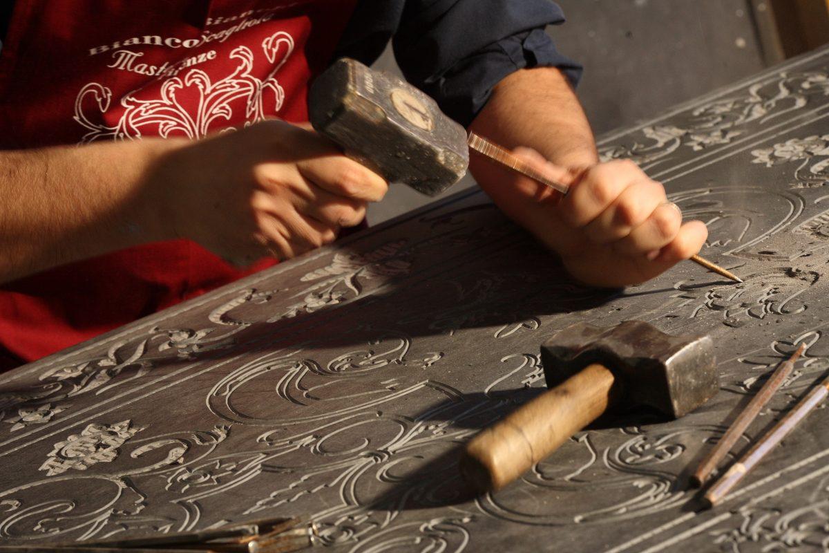 Alessandro Bianchi engraving a design in preparation for scagliola inlay. (Bianco Bianchi)
