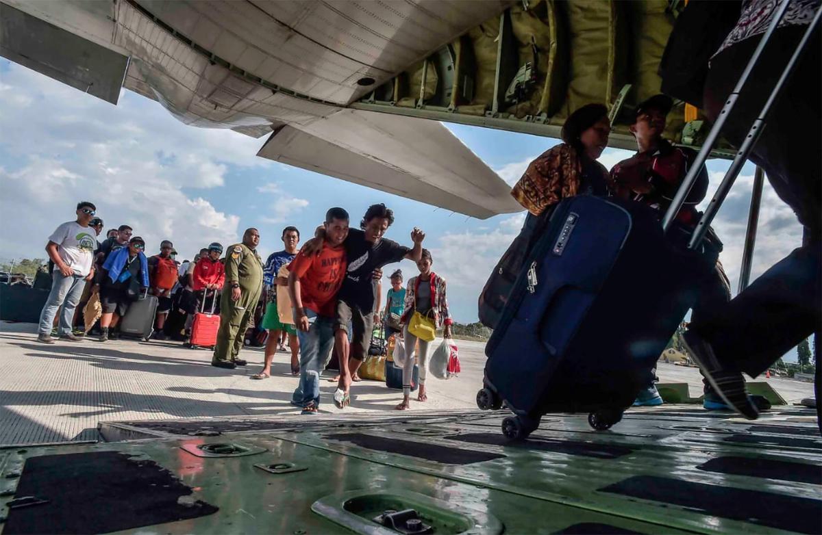 People injured or affected by the earthquake and tsunami are evacuated on an airforce plane in Palu, Central Sulawesi, Indonesia, Sept. 30, 2018. (By Antara Foto/Muhammad Adimaja/Reuters)