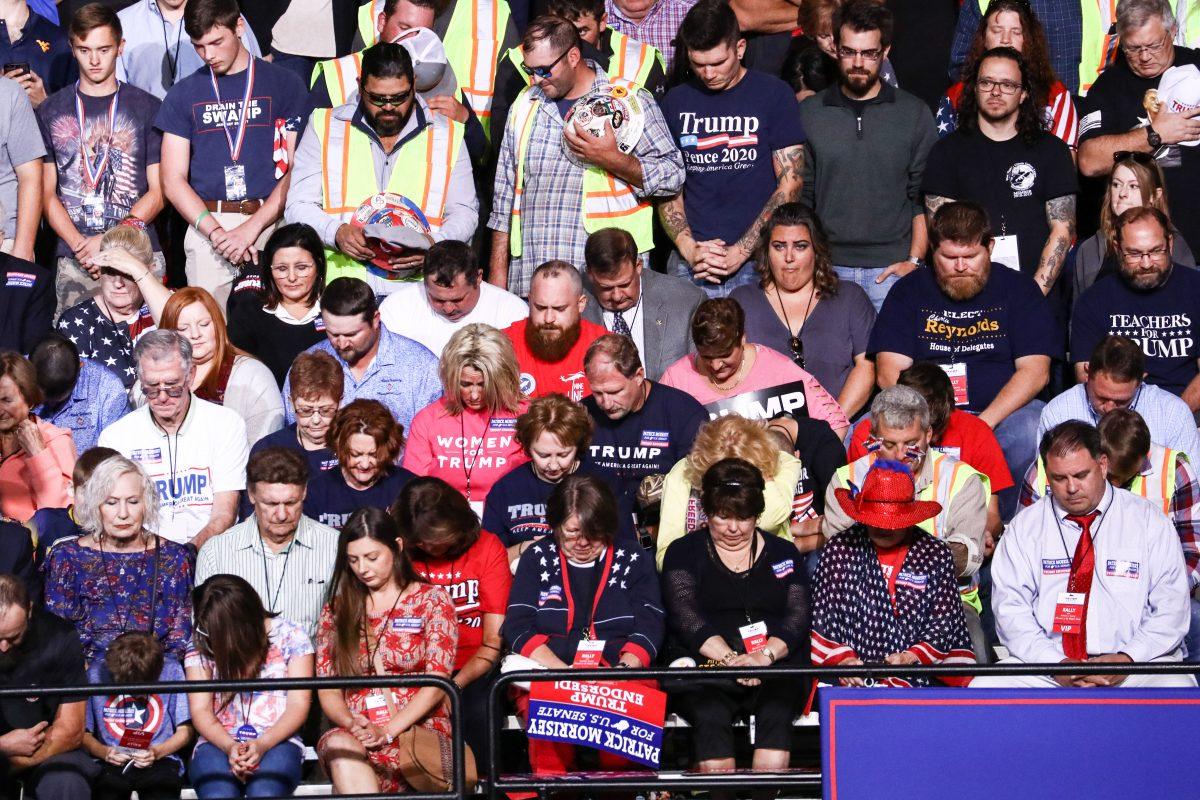 Audience members during a prayer at a Make America Great Again rally in Wheeling, West Va., on Sept. 29, 2018. (Charlotte Cuthbertson The Epoch Times)