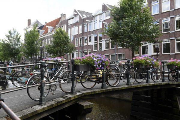 Bikes parked on a bridge crossing a canal in Amsterdam in this file photo. (Martti Kainjulainen/AFP/Getty Images)