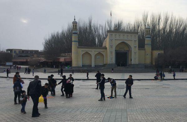Children play outside the Id-kah mosque in Kashgar, in China’s western Xinjiang region, on Feb. 18, 2018. (Ben Dooley/AFP/Getty Images)