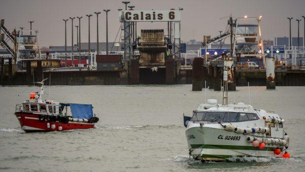 Fishing boats leave the harbor of Calais, France, to take part in a blockade to protest against electric-pulse fishing practiced by fishermen from the Netherlands on Jan. 25, 2018. (Phillipe Hugena/AFP/Getty Images)