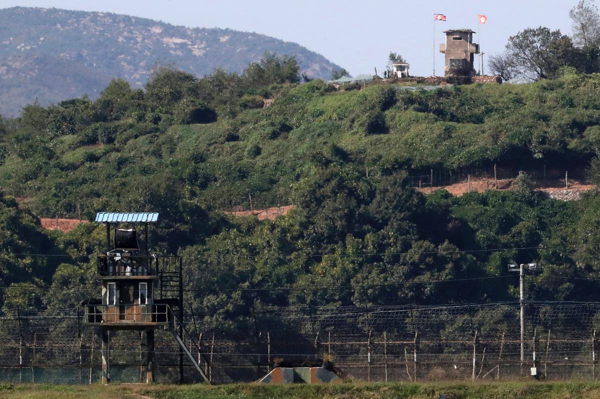 Military guard posts of North Korea, right top, and South Korea, left bottom, are seen in Paju, at the border with North Korea, South Korea. Seoul on Monday, Oct. 1, 2018, says South Korea has begun clearing mines from two sites inside the heavily fortified border with North Korea under a package of tension-reduction deal between the rivals. (Kim Do-hoon/Yonhap/AP)