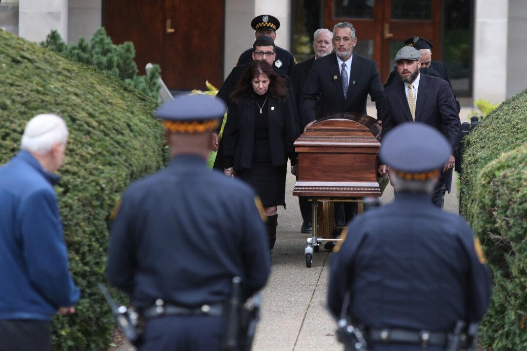 Pittsburgh Synagogue Shooting Suspect Faces New Charges as Funerals Continue