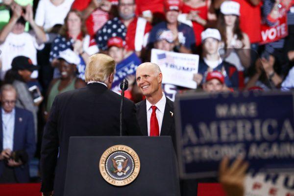 President Donald Trump and GOP Senate candidate Florida Gov. Rick Scott at a Make America Great Again rally in Fort Myers, Fla., on Oct. 31, 2018. (Charlotte Cuthbertson/The Epoch Times)