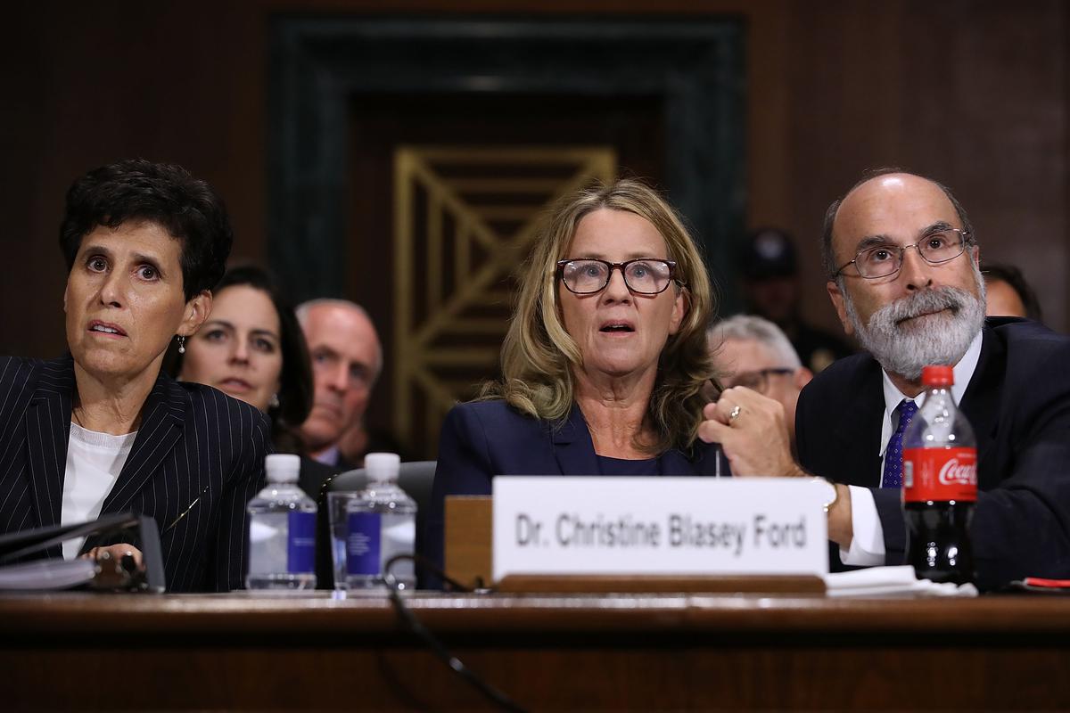 Christine Blasey Ford (C) is flanked by her attorneys, Debra Katz (L) and Michael Bromwich, as she testifies before the Senate Judiciary Committee in the Dirksen Senate Office Building on Capitol Hill in Washington on Sept. 27, 2018. (Win McNamee/Getty Images)
