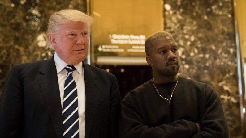 President-elect Donald Trump and Kanye West stand together in the lobby at Trump Tower in New York City, on Dec. 13, 2016. (Drew Angerer/Getty Images)