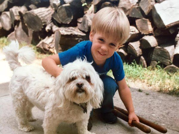 A young Marcus Soutra with his dog. (Courtesy of Eye to Eye)