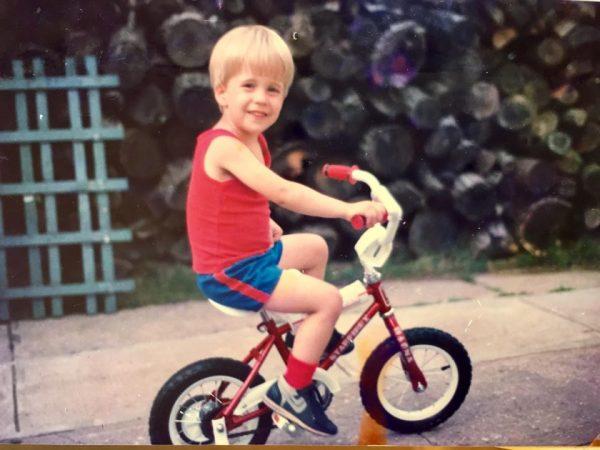 A young Marcus Soutra on his bicycle. (Courtesy of Eye to Eye)