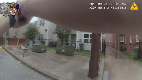 Foster points his firearm toward Sassafras on Sept. 23, according to footage released on Oct. 1, 2018, by the police. (Baltimore Police Department)