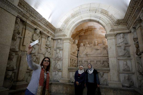 A visitor uses her mobile phone to take a selfie during the reopening of Syria's National Museum of Damascus, Syria Oct. 28, 2018. (Reuters/Omar Sanadiki)