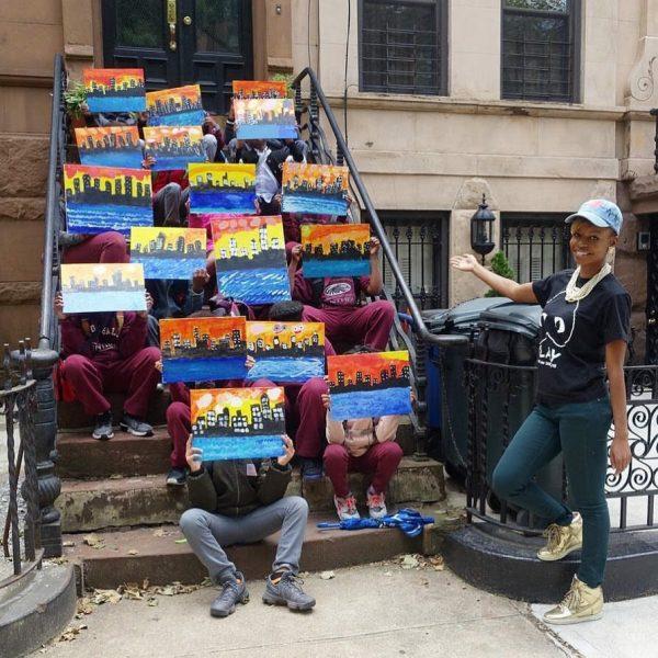 Kids can be amazingly creative when given the chance. Chanel poses with her students after a painting session in Brooklyn. (Courtesy Tiffany B. Chanel)