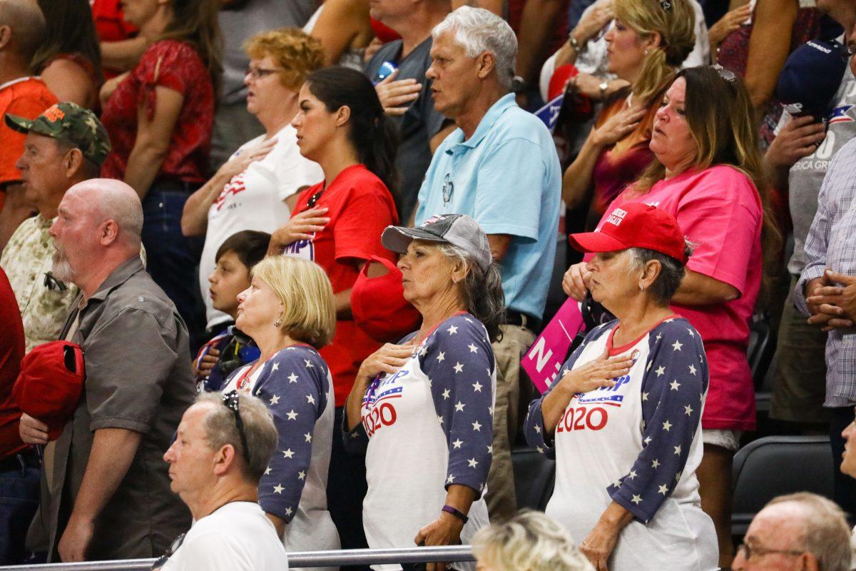 Attendees recite the Pledge of Allegiance at a Make America Great Again rally in Johnson City, Tenn., on Oct. 1, 2018. (Charlotte Cuthbertson/The Epoch Times)