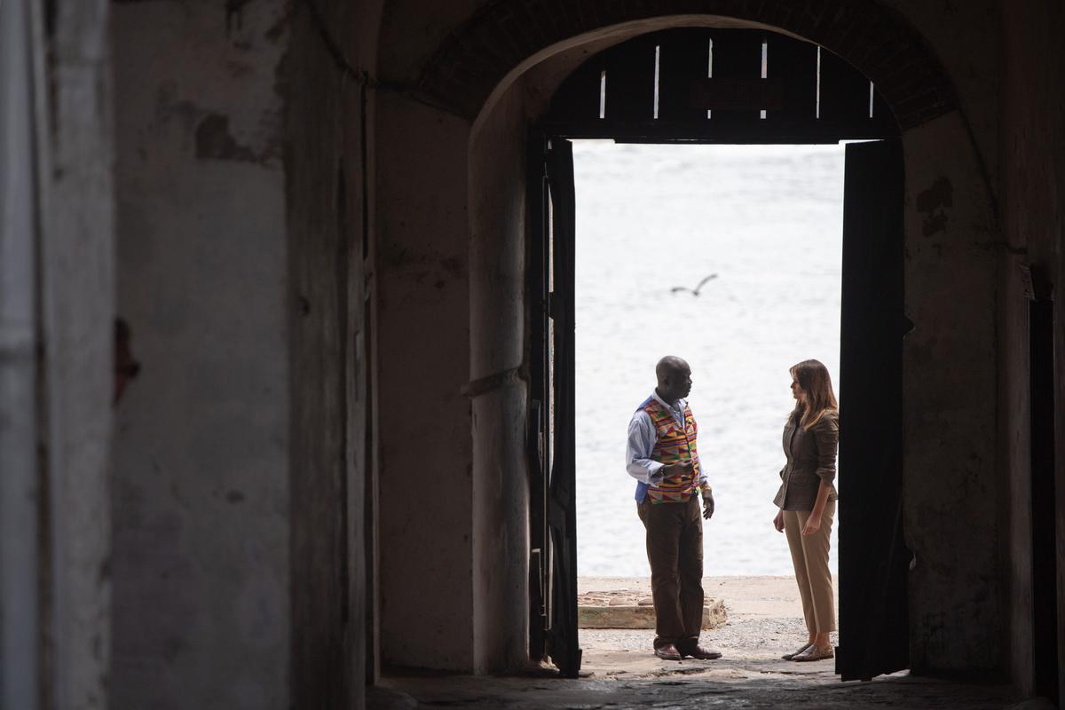 First lady Melania Trump walks through the "Door of No Return" with Kwesi Essel-Blankson, museum educator, at the Cape Coast Castle, in Cape Coast, on Oct. 3. (SAUL LOEB/AFP/Getty Images)