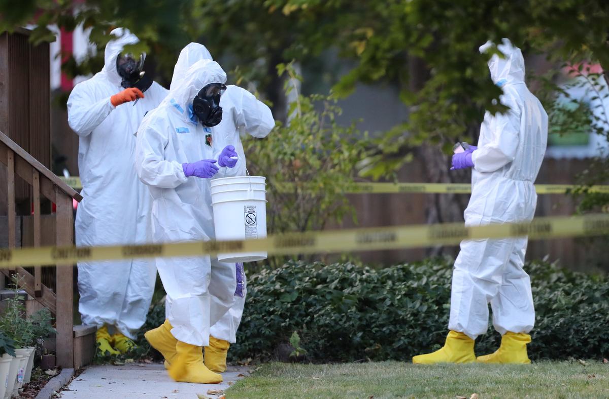 FBI and law enforcement officers in hazmat suites prepare to enter a house, which FBI says was investigating "potentially hazardous chemicals" in Logan, Utah, U.S., October 3, 2018. (George Frey/Reuters)
