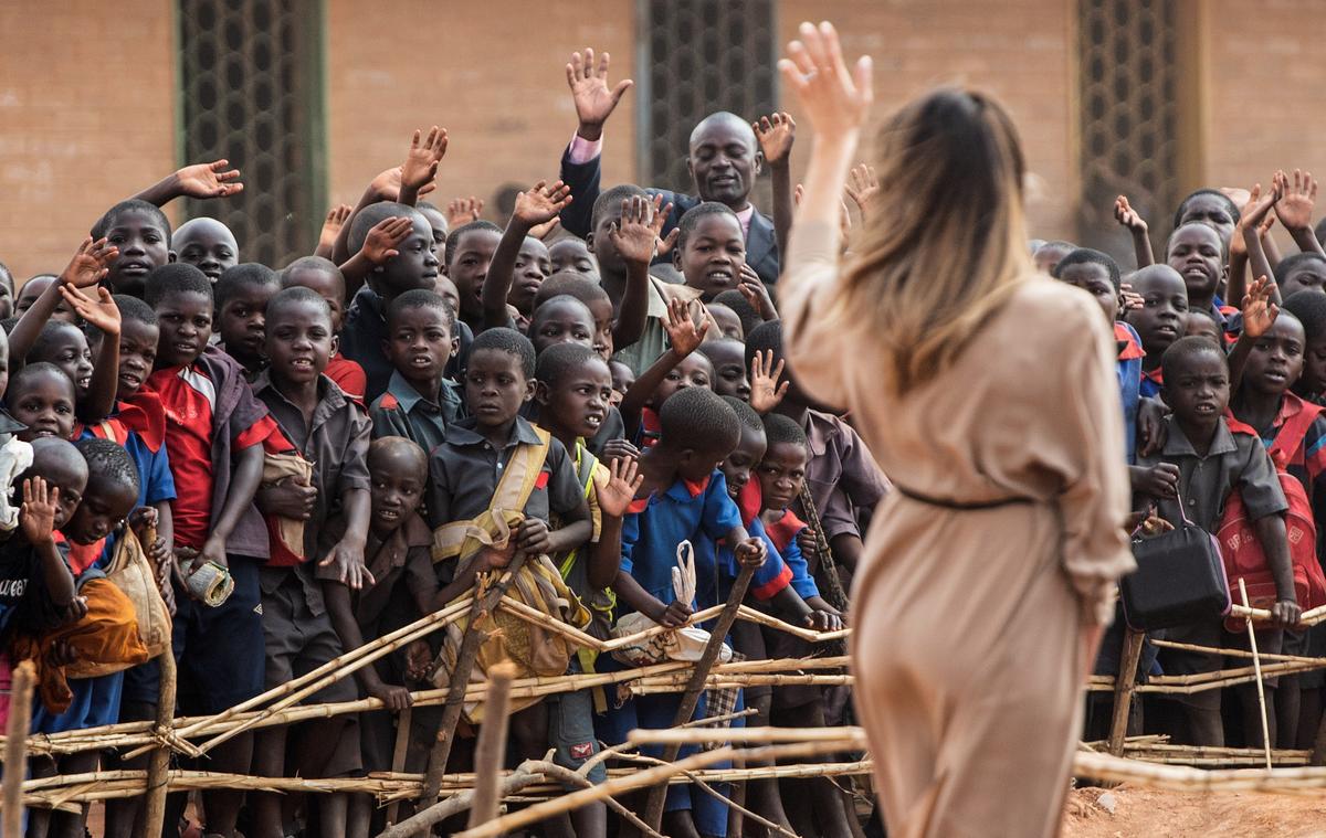 First Lady Melania Trump waves to children at the Chipala Primary School in Lilongwe on Oct. 4, 2018. (SAUL LOEB/AFP/Getty Images)