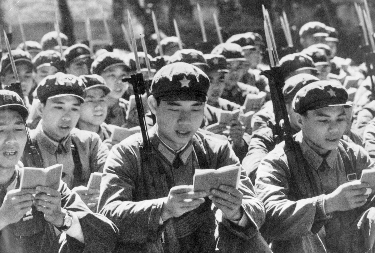 Chinese Red Guards reading from the little red book of “Thoughts of Chairman Mao” before starting their day, circa 1970. (Keystone/Getty Images)