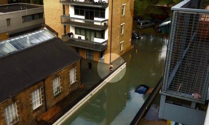 London Schoolboy Goes to School Despite Flood