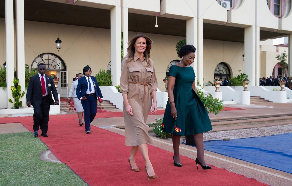 First Lady Melania Trump (L) and the first lady of Malawi Gertrude Maseko walk at the State House in Lilongwe, on Oct. 4. (SAUL LOEB/AFP/Getty Images)