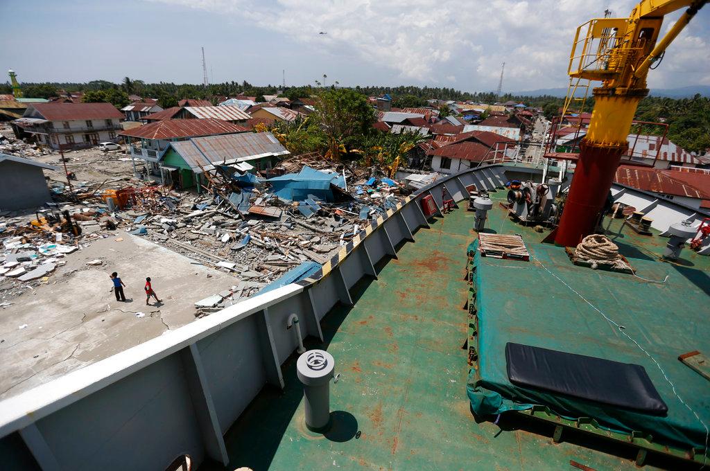 A tsunami-ravaged area where the Sabuk Nusantara 39 ship has ran aground is seen on Oct. 4, 2018, from the bridge of the ship which was swept ashore by the tsunami in Wani village on the outskirt of Palu, Central Sulawesi, Indonesia Indonesia.(AP Photo/Dita Alangkara)