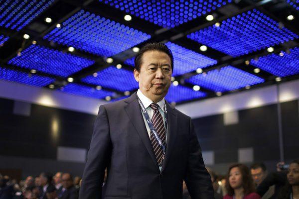 Interpol President Meng Hongwei walks toward the stage to deliver his opening address at the Interpol World congress in Singapore on July 4, 2017. (Wong Maye/AP Photo)