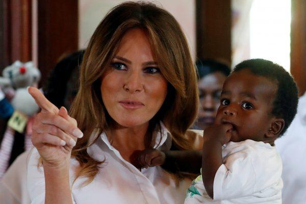 U.S. First Lady Melania Trump holds a child at The Nest Children's Home in Nairobi, Kenya, on Oct. 5, 2018. (Carlo Allegri/Reuters)