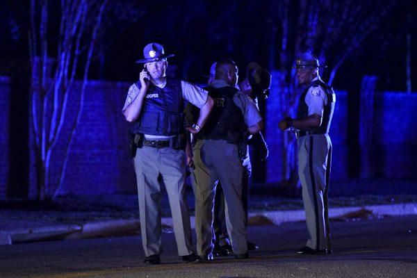South Carolina state troopers gather on Hoffmeyer Road near the Vintage Place neighborhood where several law enforcement officers were shot in Florence, S.C., on Oct. 3, 2018. (Sean Rayford/AP)