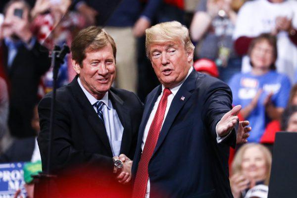 President Donald Trump and Rep. Jason Lewis (R-Minn.) at a Make America Great Again rally in Rochester, Minn., on Oct. 4, 2018. (Charlotte Cuthbertson/The Epoch Times)
