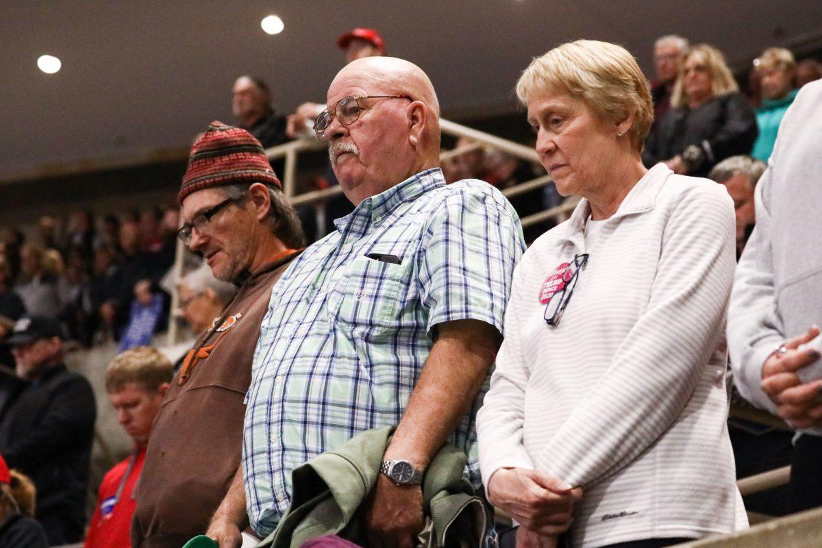 Attendees during the invocation at a Make America Great Again rally in Rochester, Minn., on Oct. 4, 2018. (Charlotte Cuthbertson/The Epoch Times)